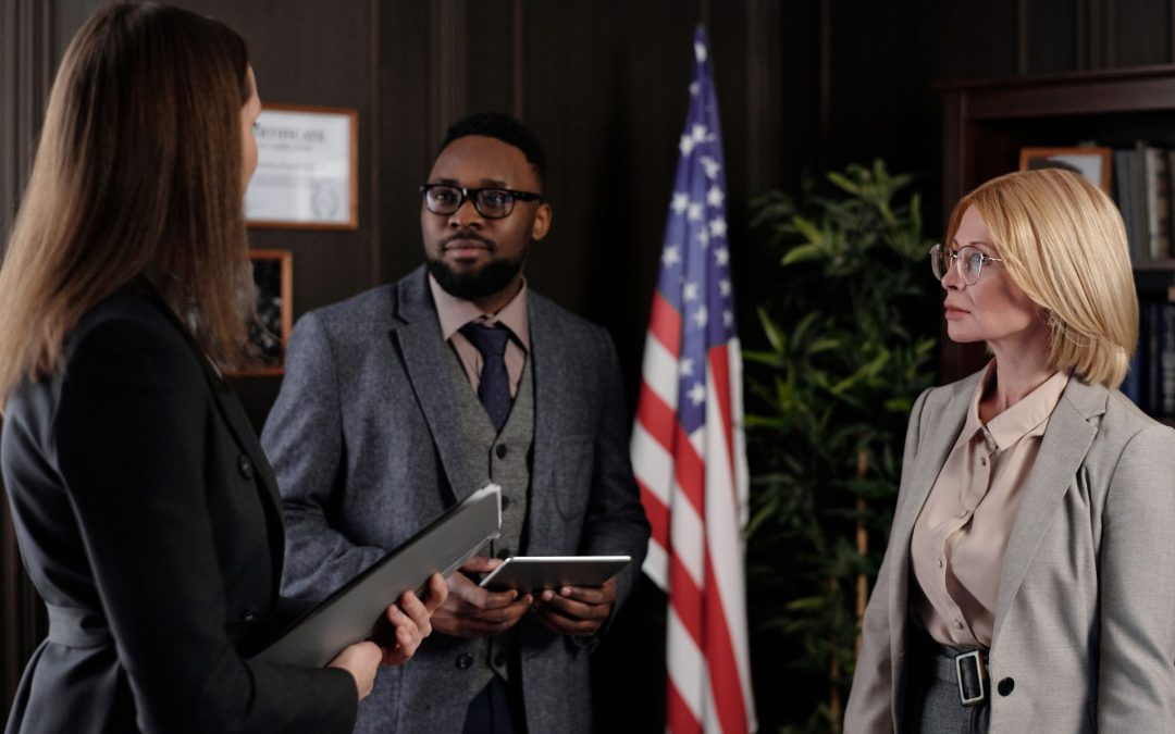 Corporate legal executives discussing legal leadership in an office